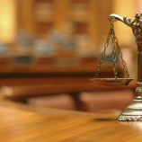 Symbol of law and justice in the empty courtroom, law and justice concept.